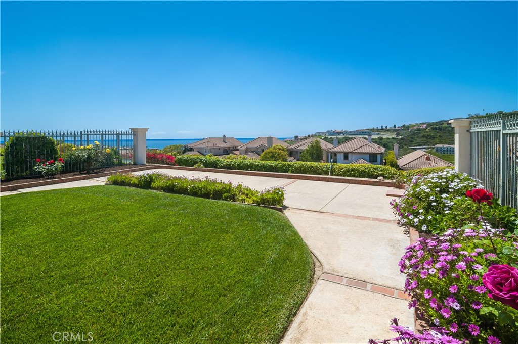 51 Santa Lucia Dana Point, CA 92629 - Photo 35 of 50 a view of a garden with a building in the background