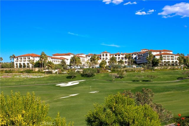 a view of a grassy field with an trees