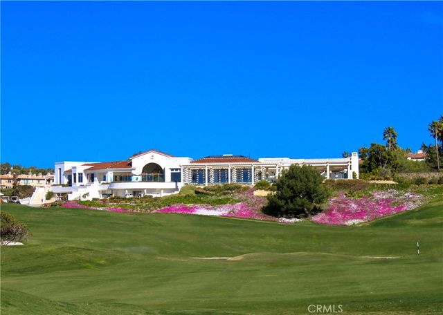 a front view of a house with a big yard