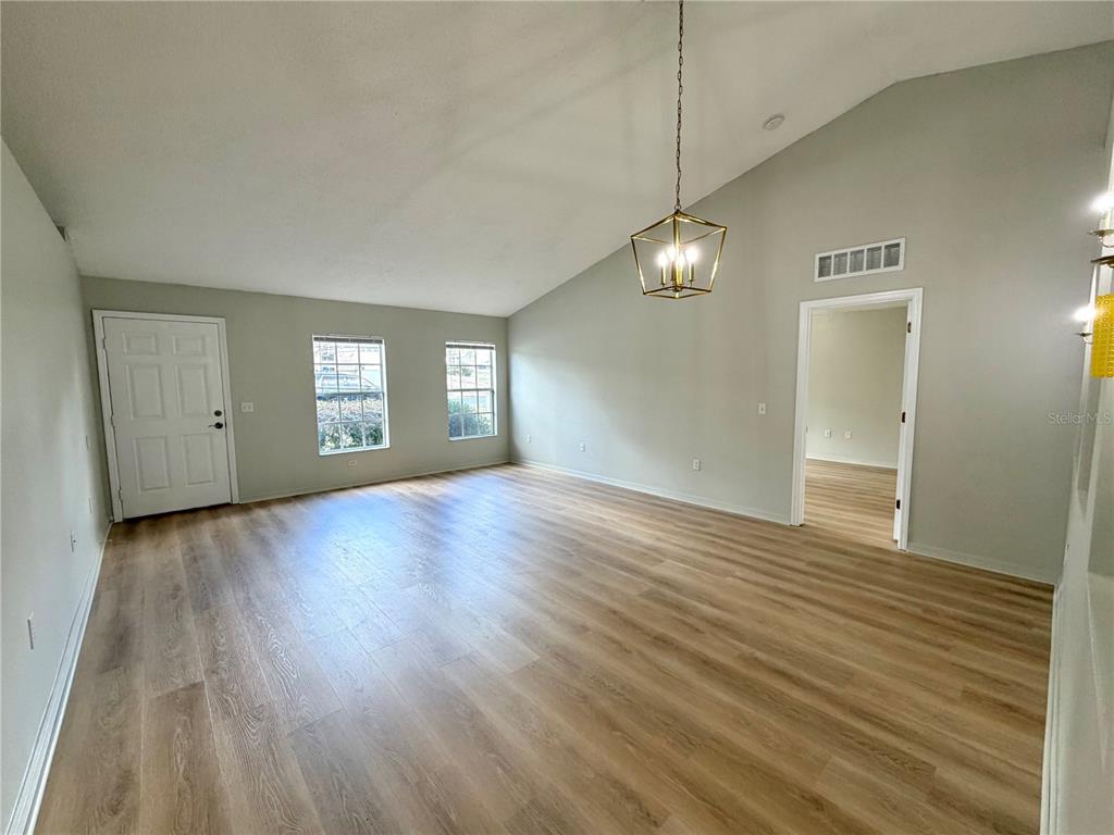 12052 Villa Road Spring Hill, FL 34609 - Photo 11 of 50 a view of a livingroom with wooden floor and window