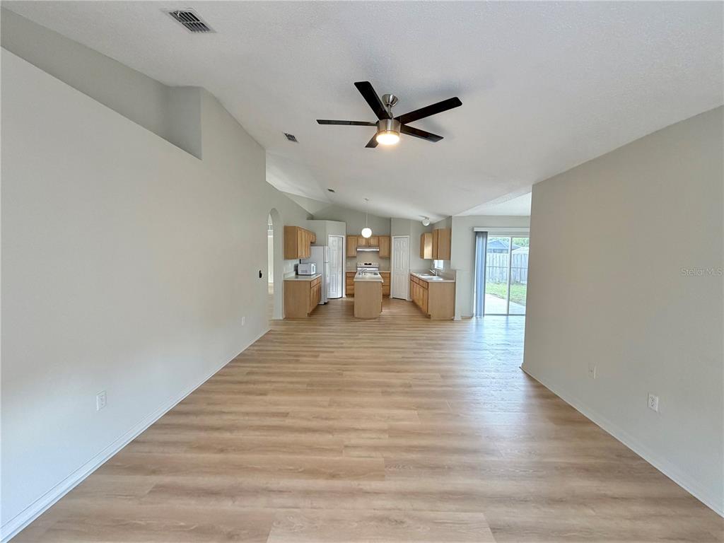 12052 Villa Road Spring Hill, FL 34609 - Photo 15 of 50 a view of empty room with wooden floor