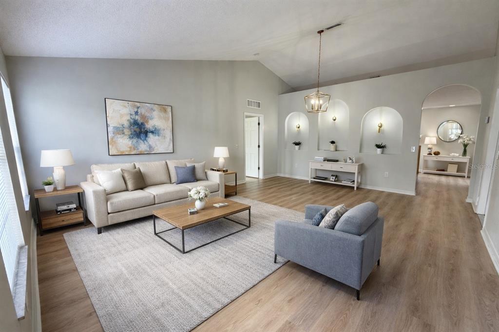 12052 Villa Road Spring Hill, FL 34609 - Photo 2 of 50 a living room with furniture and wooden floor