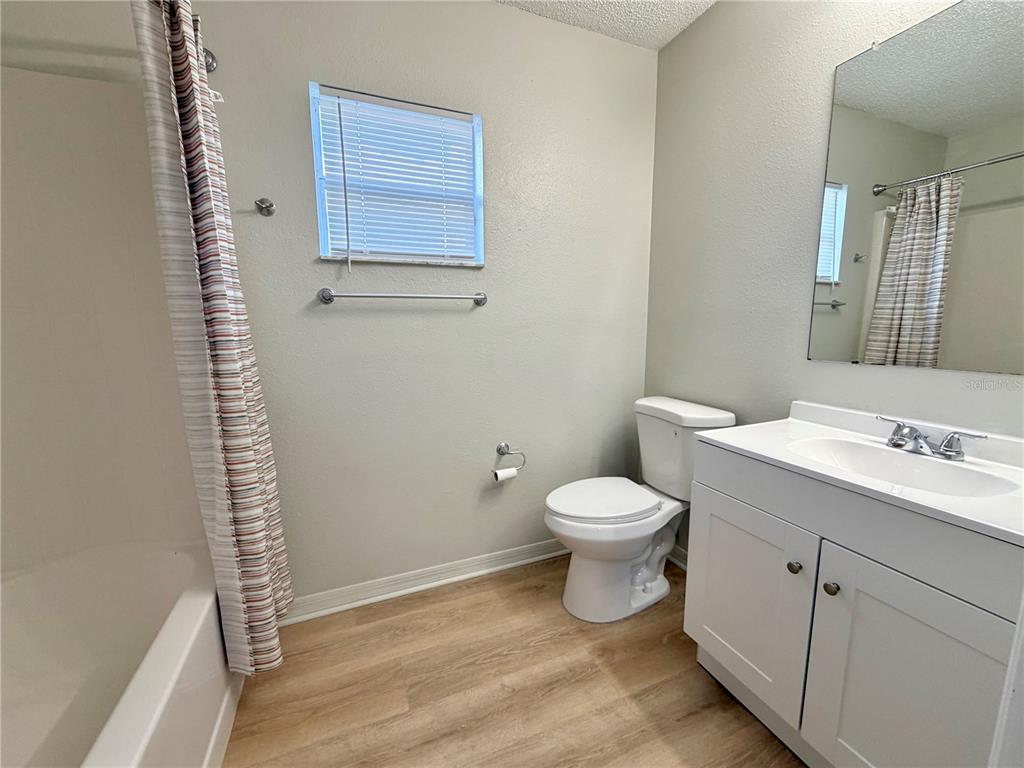 12052 Villa Road Spring Hill, FL 34609 - Photo 25 of 50 a bathroom with a toilet sink and shower