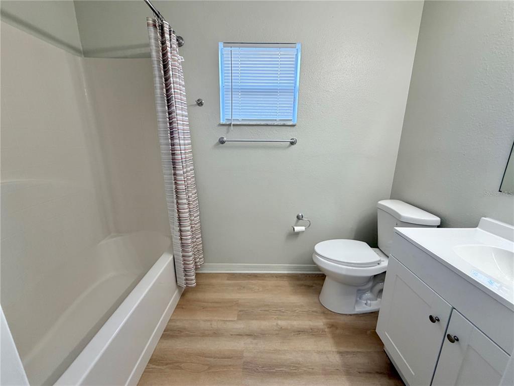 12052 Villa Road Spring Hill, FL 34609 - Photo 27 of 50 a bathroom with a toilet and shower