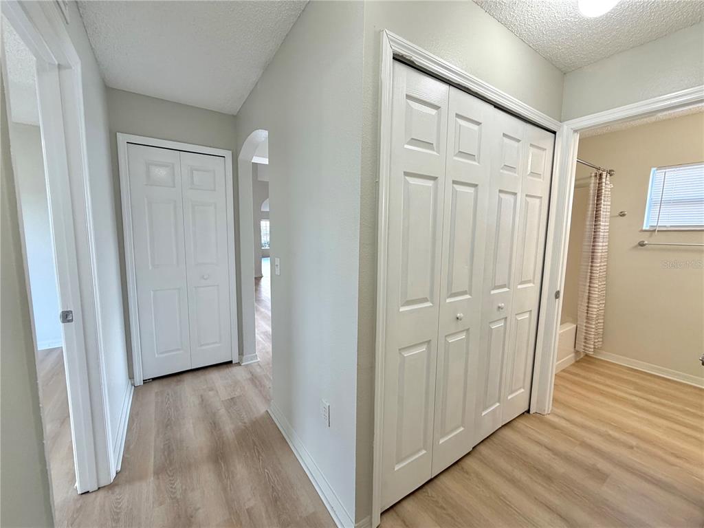 12052 Villa Road Spring Hill, FL 34609 - Photo 32 of 50 a view of a hallway with wooden floor