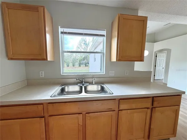 a kitchen with a sink and cabinets