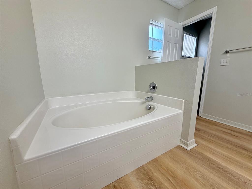 12052 Villa Road Spring Hill, FL 34609 - Photo 48 of 50 a white bath tub sitting in a bathroom