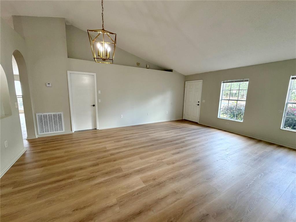 12052 Villa Road Spring Hill, FL 34609 - Photo 50 of 50 a view of an empty room with wooden floor and a window
