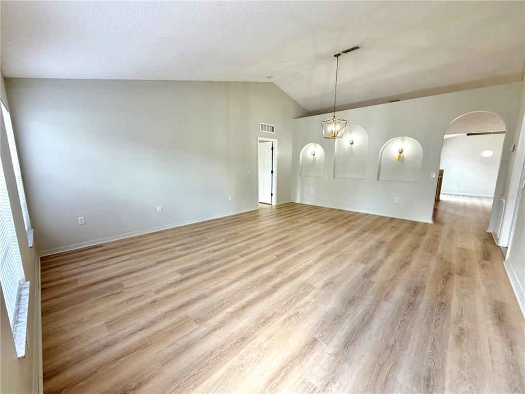 12052 Villa Road Spring Hill, FL 34609 - Photo 10 of 50 a view of a room with wooden floor
