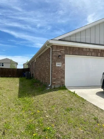 a view of backyard with large trees