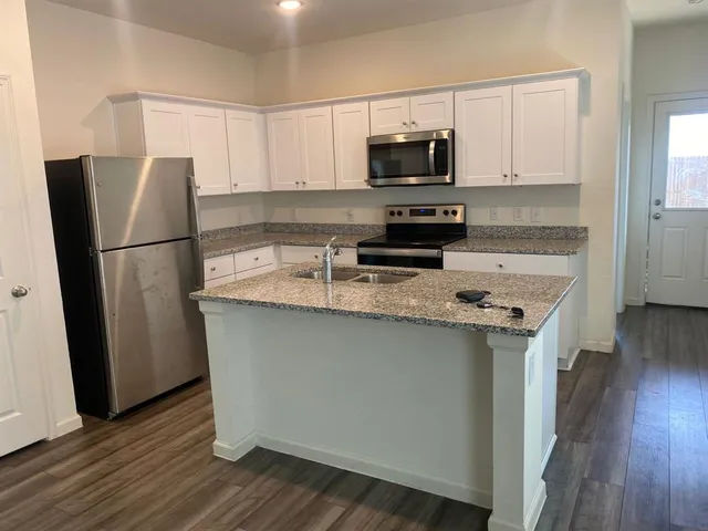 a view of wooden floor and brick wall
