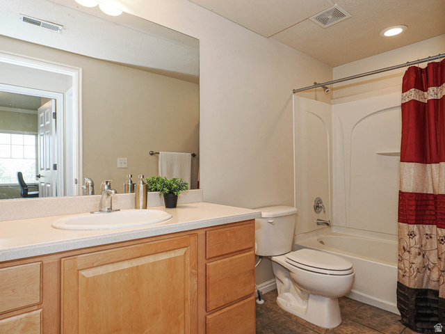 1138 Meadow Fork Road, Unit 7 Provo, UT 84606 - Photo 24 of 27 Bathroom featuring a light-toned wood vanity, integrated sink, and substantial mirror