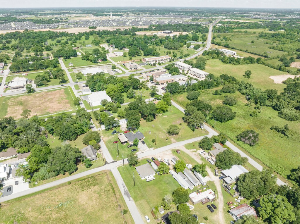 8108 Syms Street Fulshear, TX 77441 - Photo 6 of 8 an aerial view of residential houses with outdoor space