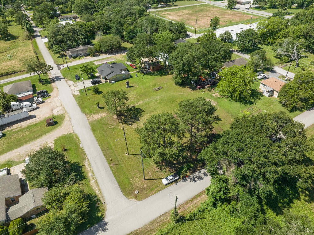 8108 Syms Street Fulshear, TX 77441 - Photo 7 of 8 an aerial view of residential house with outdoor space and trees all around