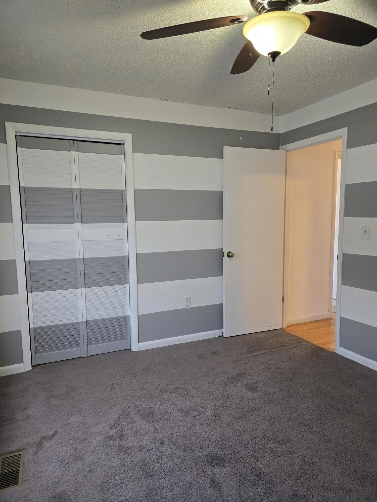 6063 Spring Place Road Southeast Cleveland, TN 37323 - Photo 20 of 44 a view of an empty room with a ceiling fan