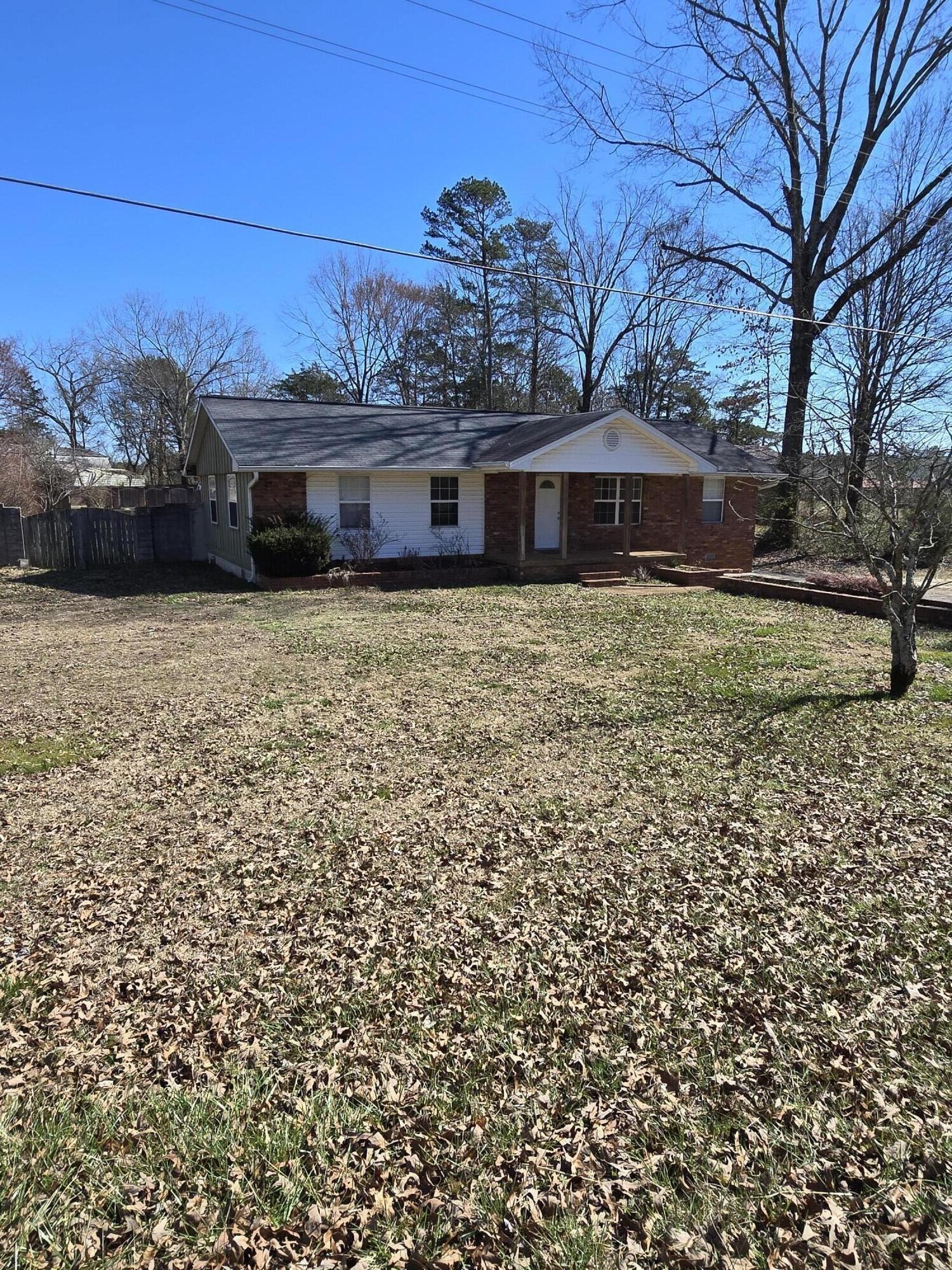 6063 Spring Place Road Southeast Cleveland, TN 37323 - Photo 2 of 44 a front view of a house with a garden
