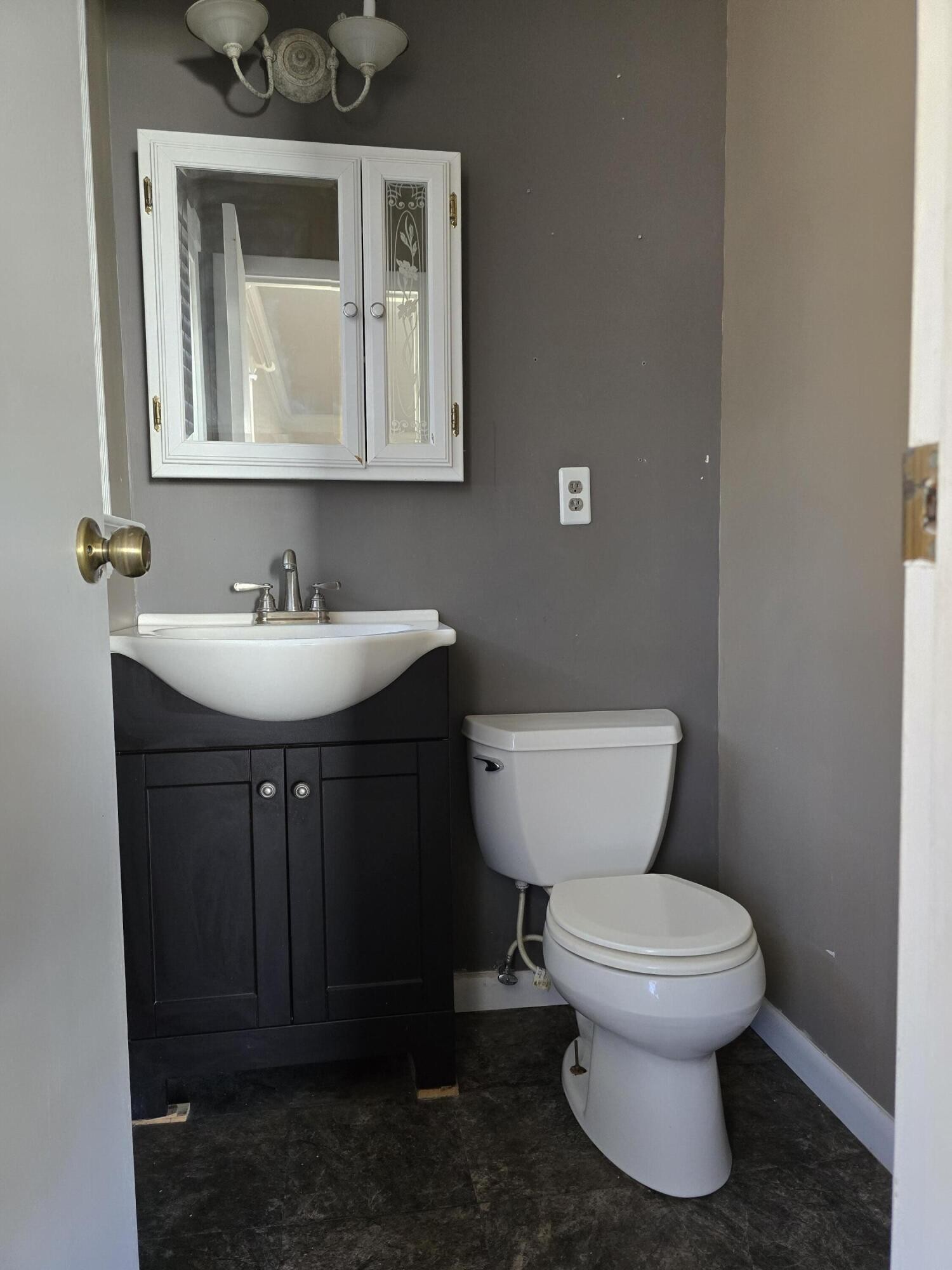 6063 Spring Place Road Southeast Cleveland, TN 37323 - Photo 27 of 44 a bathroom with a toilet sink and mirror
