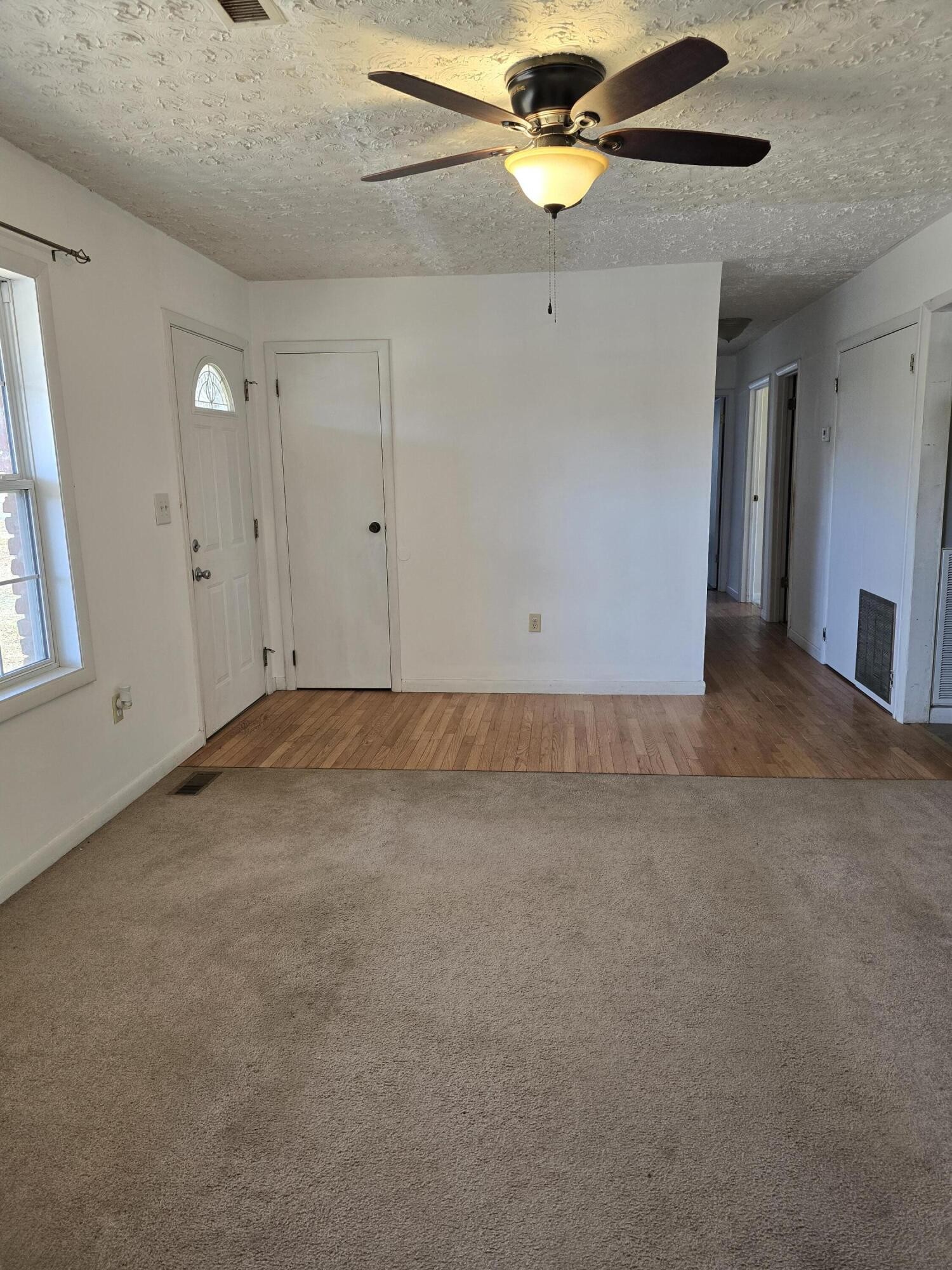 6063 Spring Place Road Southeast Cleveland, TN 37323 - Photo 3 of 44 an empty room with windows and fan