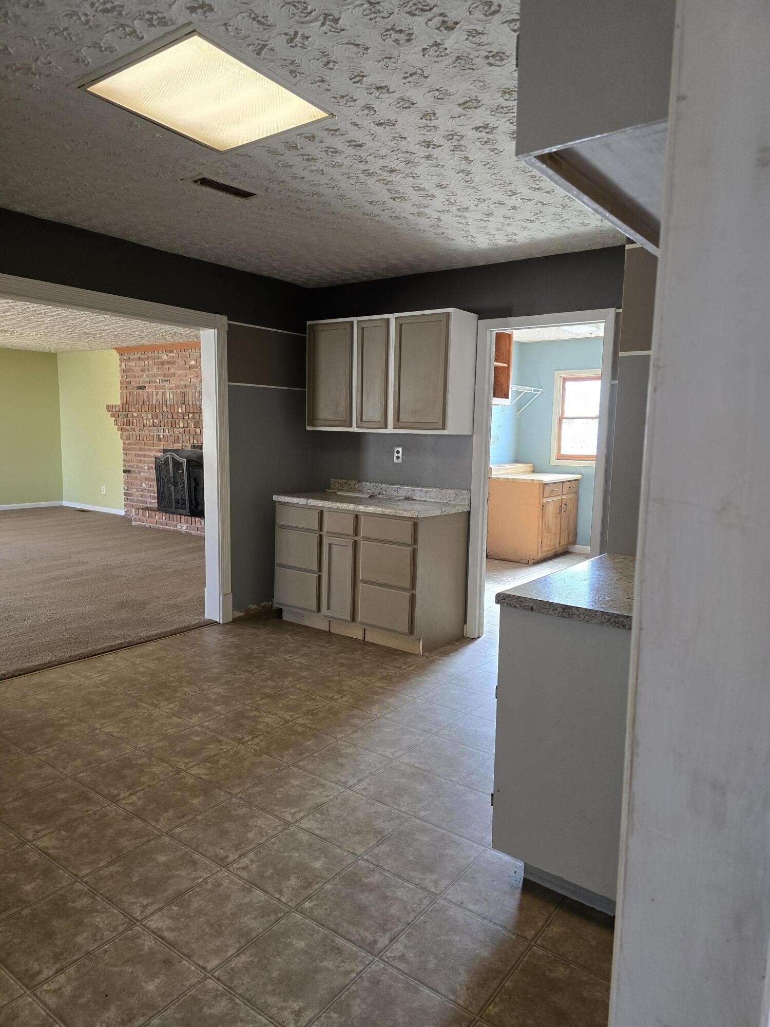 6063 Spring Place Road Southeast Cleveland, TN 37323 - Photo 6 of 44 an empty room with kitchen view and a window