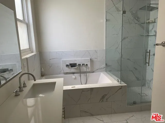 a bathroom with a sink and a bathtub
