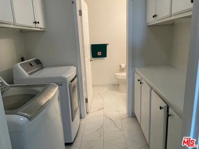 a bathroom with a sink and toilet