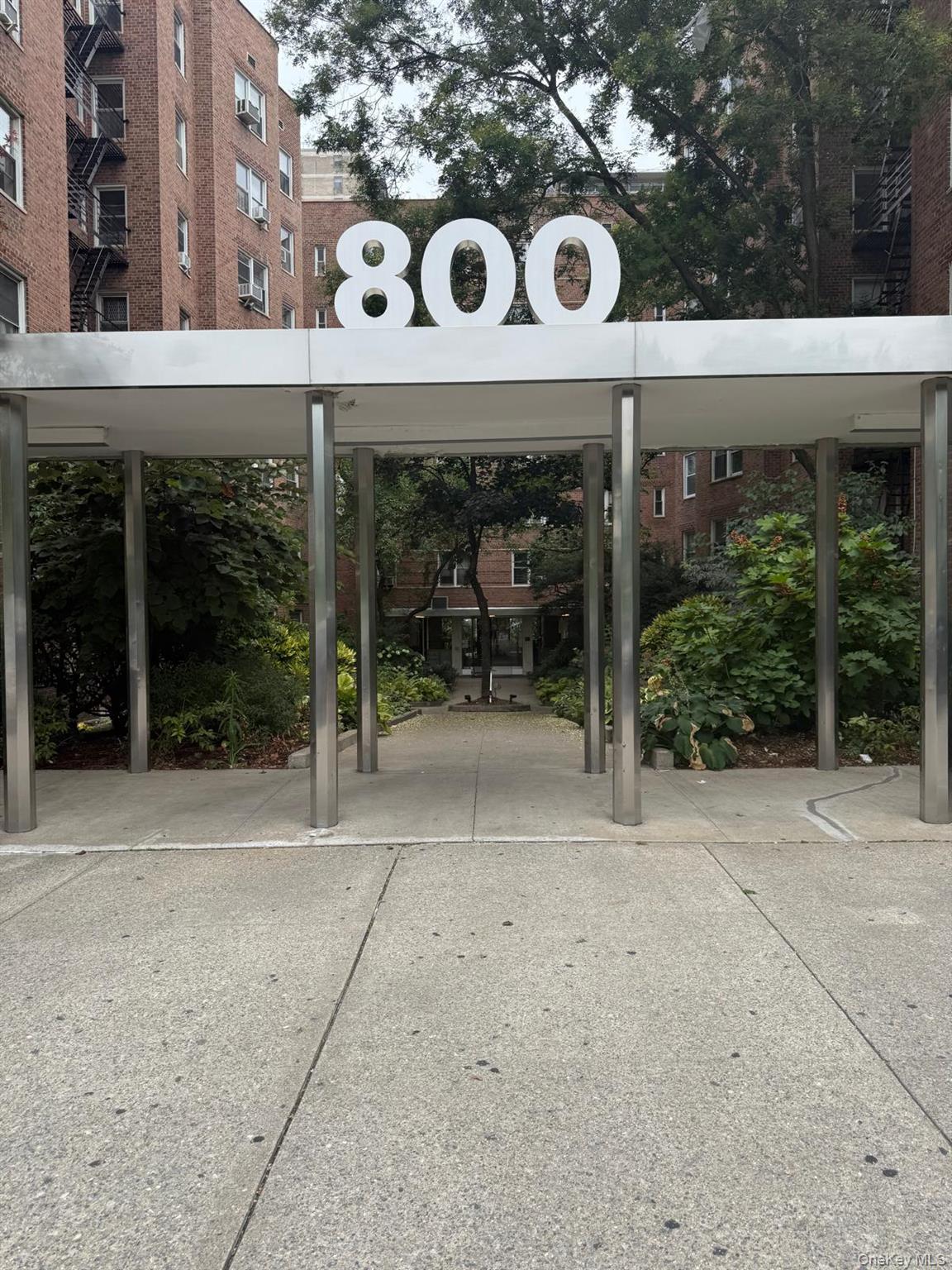 800 Grand Concourse, Unit LEN Bronx, NY 10451 - Photo 10 of 10 a front view of a building with garden