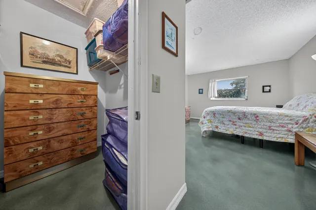 a bedroom with a bed and a cabinets