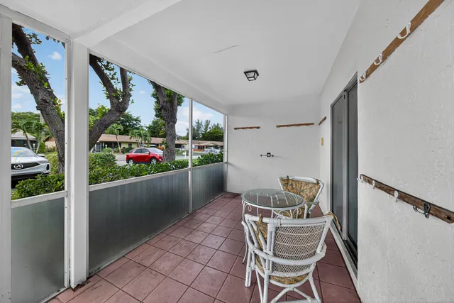 a living room with furniture and garden view