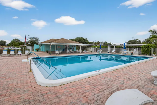 a view of a swimming pool with a patio