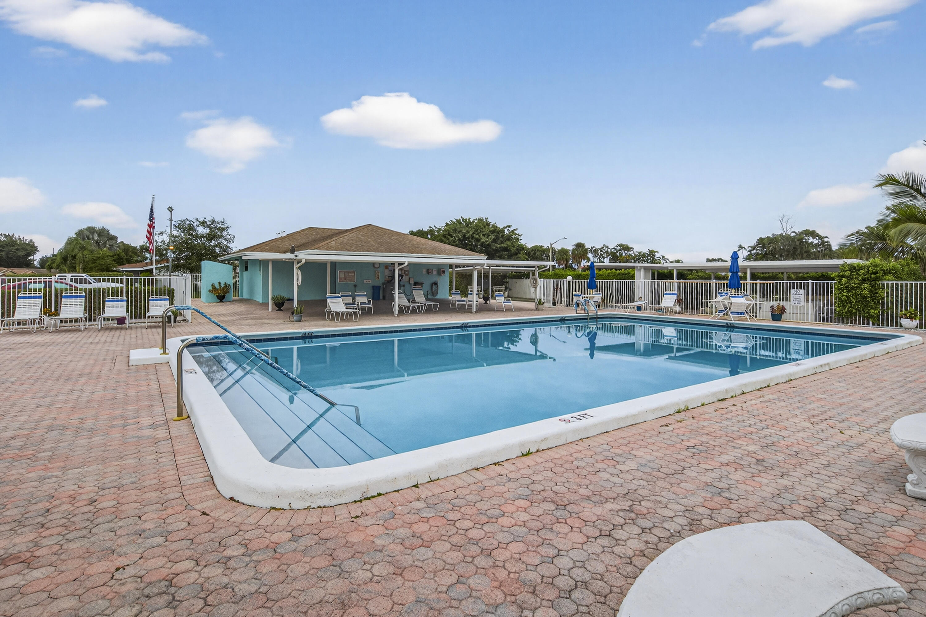 14236 Campanelli Drive Delray Beach, FL 33484 - Photo 31 of 33 a view of a swimming pool with a patio