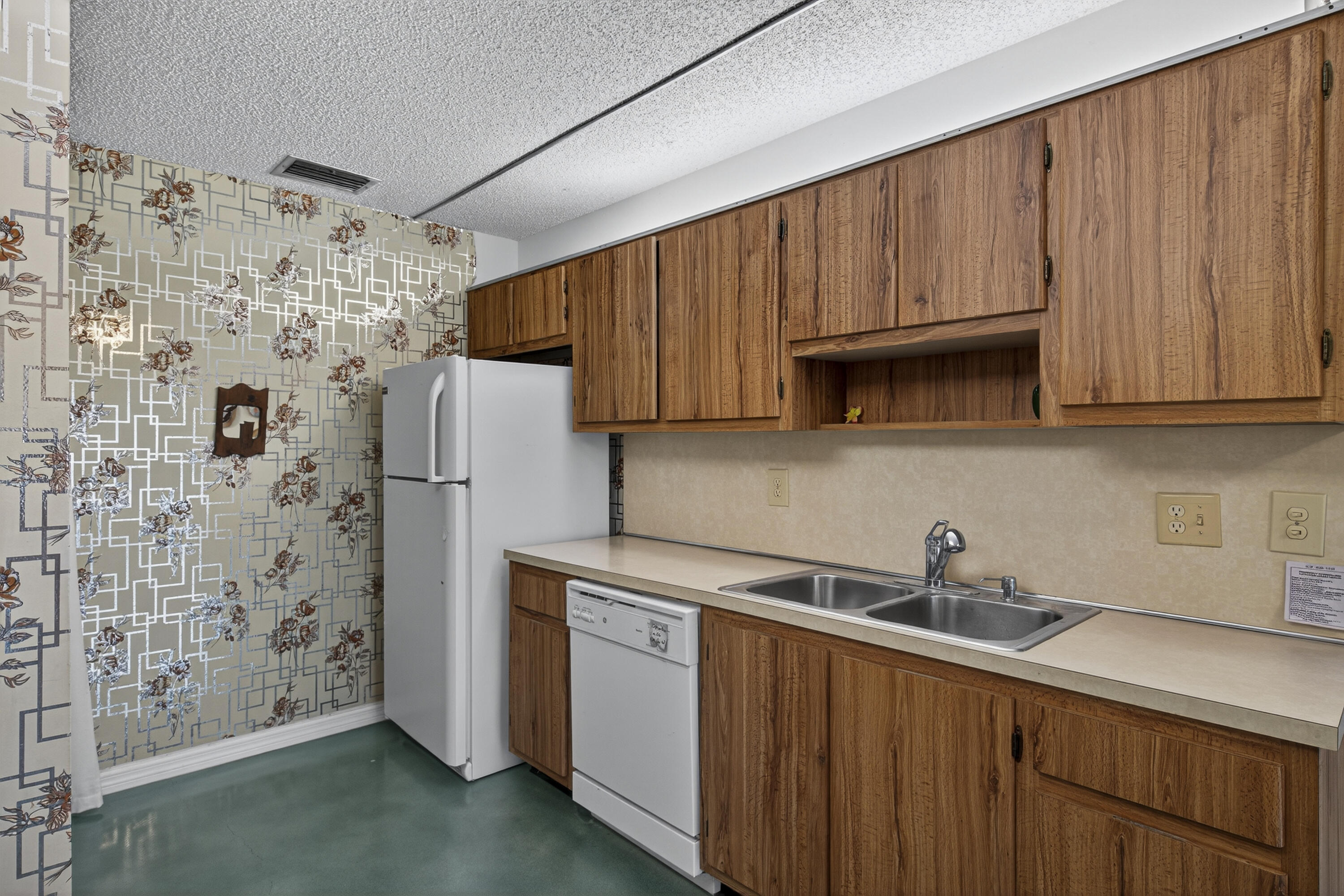 14236 Campanelli Drive Delray Beach, FL 33484 - Photo 7 of 33 a kitchen with stainless steel appliances a refrigerator and a sink