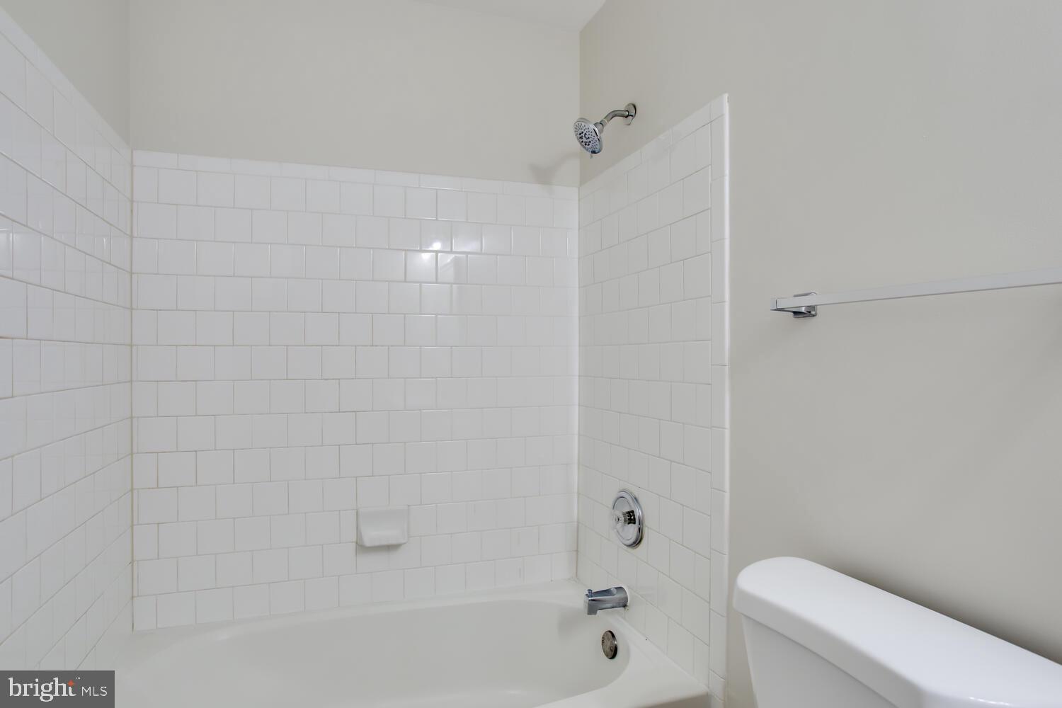 7024 Commander Howe Terrace Brandywine, MD 20613 - Photo 28 of 34 a bathroom with a bathtub and a toilet