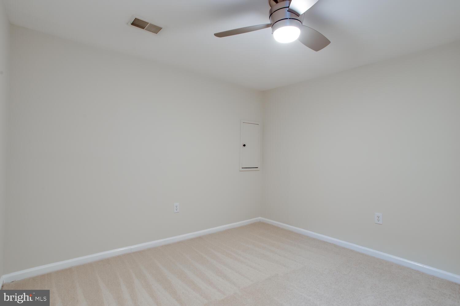 7024 Commander Howe Terrace Brandywine, MD 20613 - Photo 34 of 34 a view of an empty room with a chandelier fan