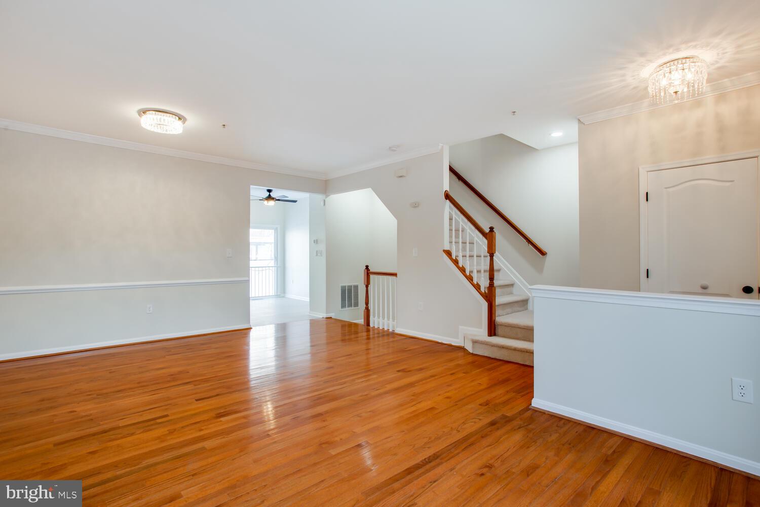 7024 Commander Howe Terrace Brandywine, MD 20613 - Photo 4 of 34 a view of entryway and hall with wooden floor