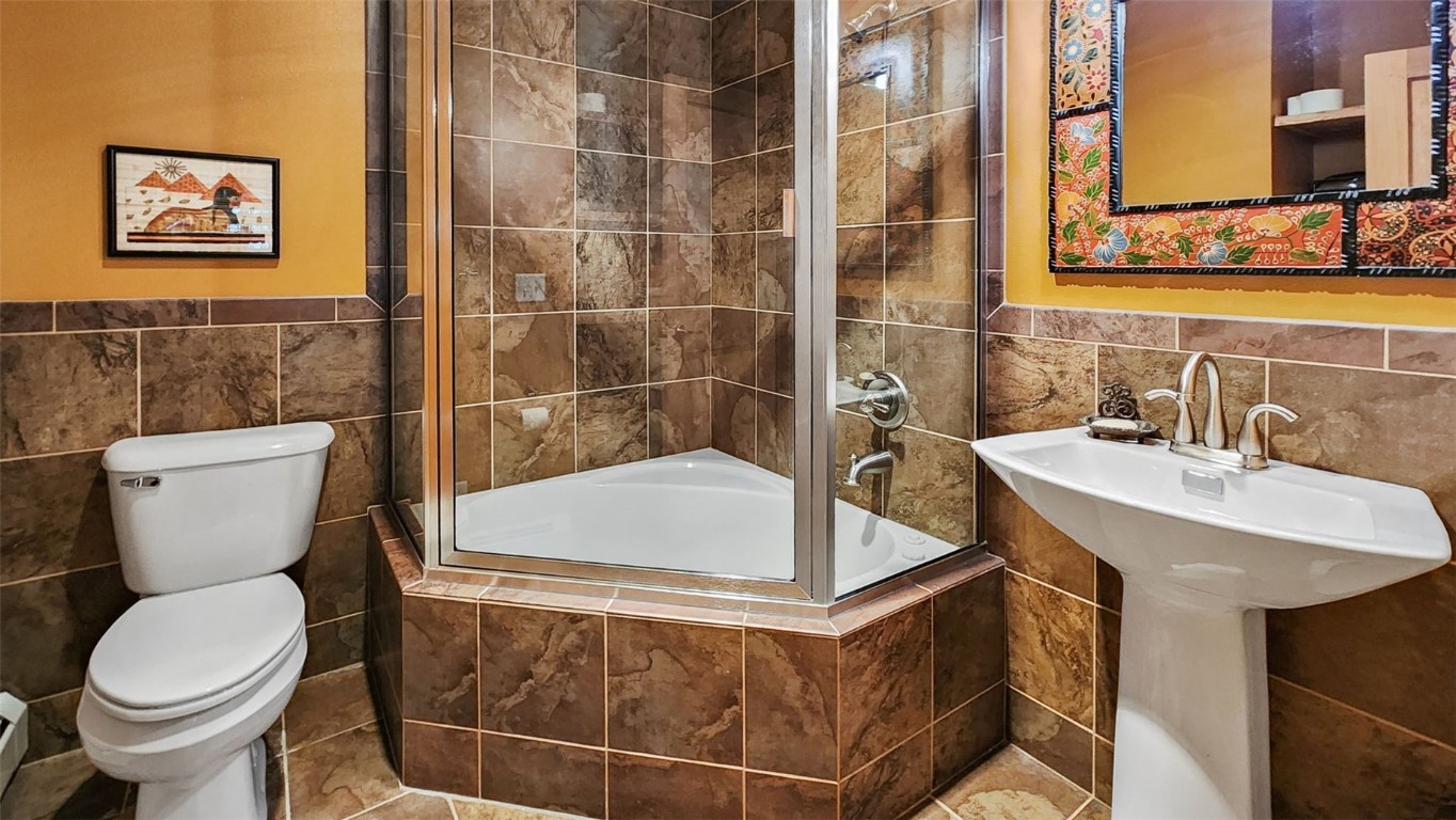 44 Gold Trail Circle Fairplay, CO 80440 - Photo 19 of 40 a bathroom with a sink a toilet and a mirror