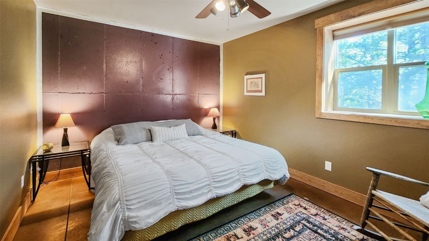 44 Gold Trail Circle Fairplay, CO 80440 - Photo 34 of 40 a bedroom with a bed and a lamp