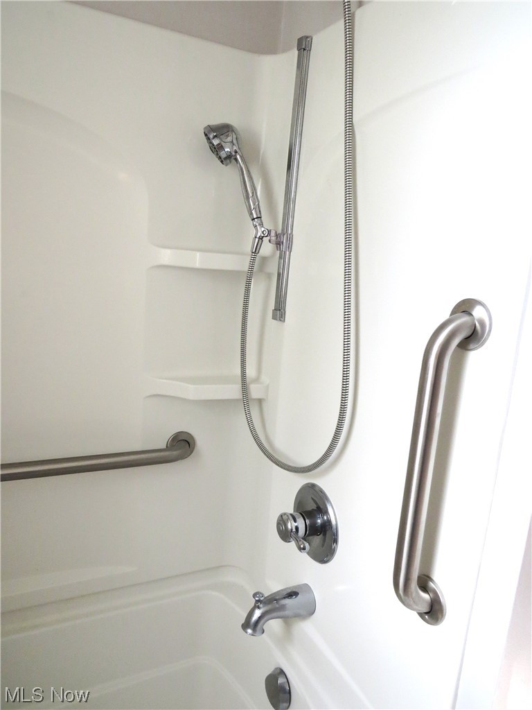 10130 Lee Road Minerva, OH 44657 - Photo 12 of 35 Hallway bathroom tub/shower combination with grab bars. Very handy and safe.