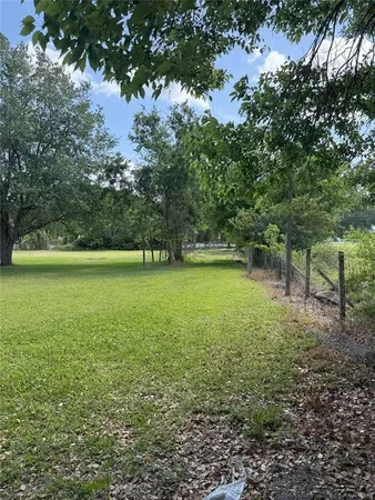 a view of outdoor space with deck and yard