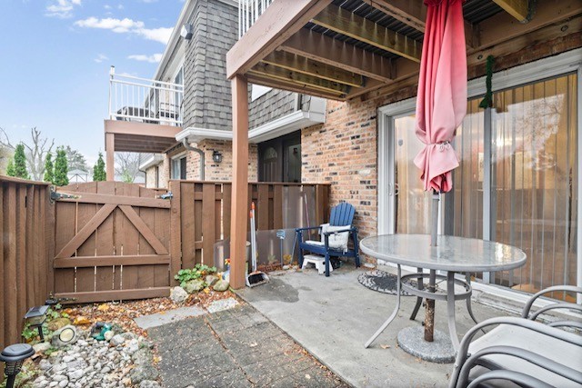 4704 Euclid Avenue, Unit 1B Rolling Meadows, IL 60008 - Photo 18 of 20 a view of a dinning tables and chairs in patio