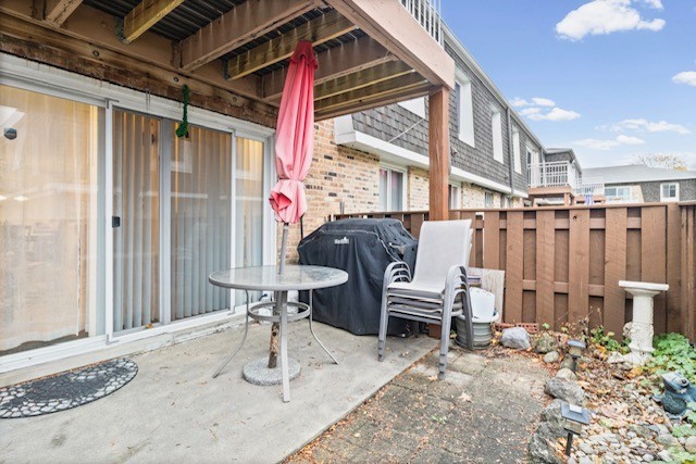 4704 Euclid Avenue, Unit 1B Rolling Meadows, IL 60008 - Photo 19 of 20 a view of a patio with table and chairs