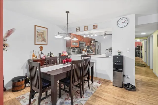 a view of a dining room with furniture and wooden floor