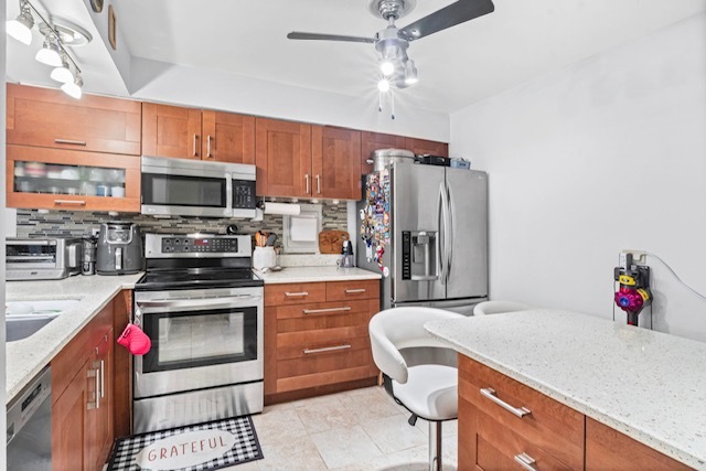 4704 Euclid Avenue, Unit 1B Rolling Meadows, IL 60008 - Photo 7 of 20 a kitchen with stainless steel appliances kitchen island granite countertop a refrigerator and a stove top oven