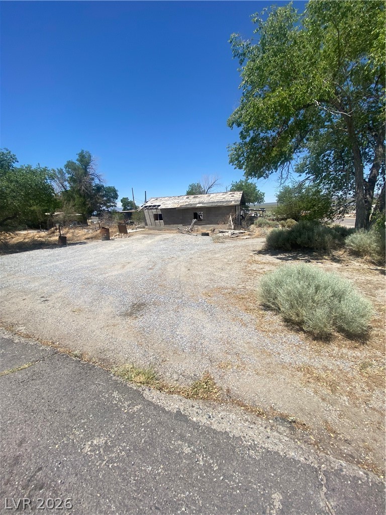 701 3rd Street Gabbs, NV 89409 - Photo 4 of 10 Discover a unique opportunity to revitalize this intriguing structure nestled among mature trees.
