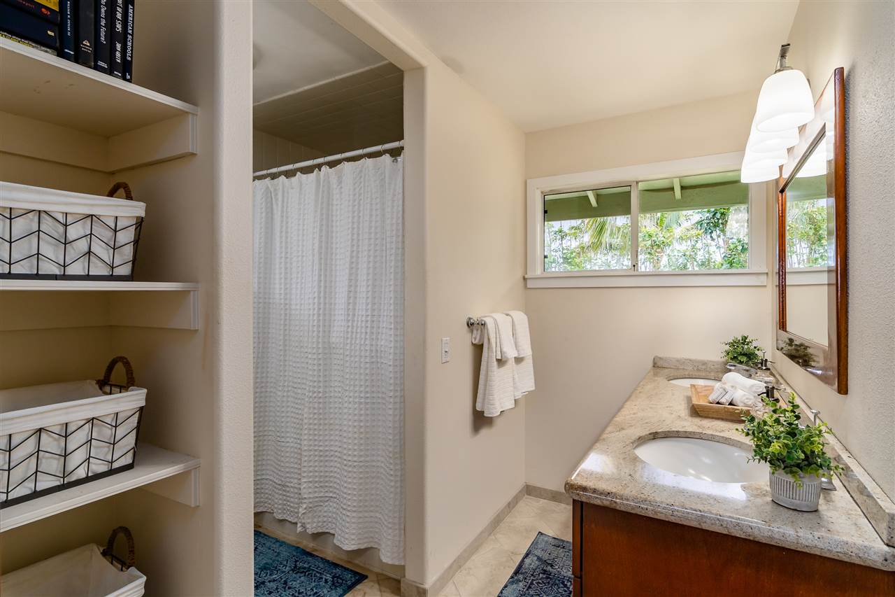 3175 Ua Noe Place, Unit A Haiku, HI 96708 - Photo 17 of 29 a bathroom with a sink and a mirror