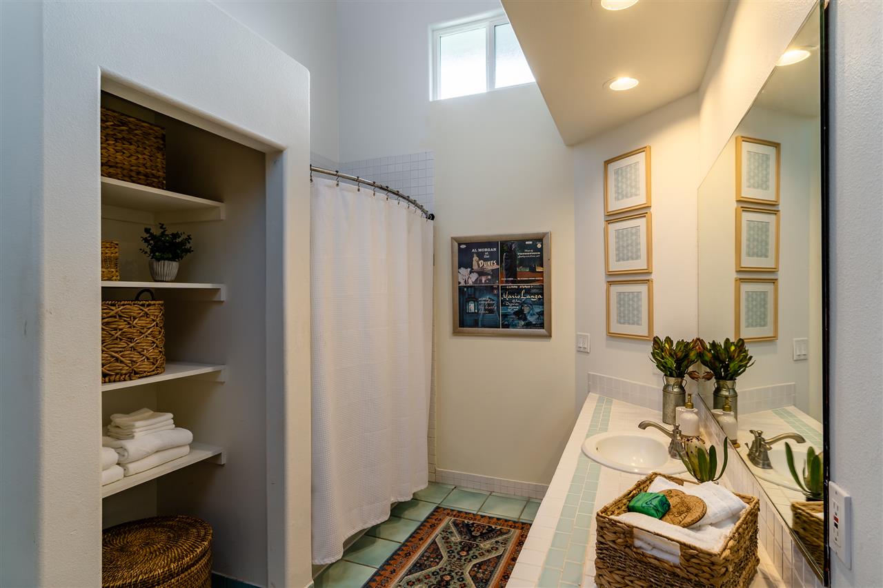 3175 Ua Noe Place, Unit A Haiku, HI 96708 - Photo 22 of 29 a bedroom with furniture and a book shelf