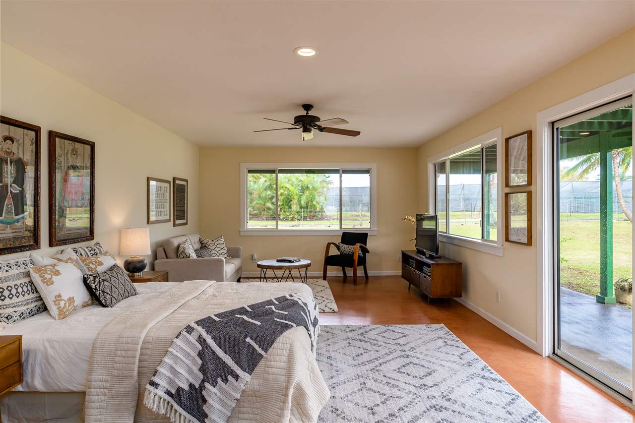 3175 Ua Noe Place, Unit A Haiku, HI 96708 - Photo 23 of 29 a bed room with a bed and a couch