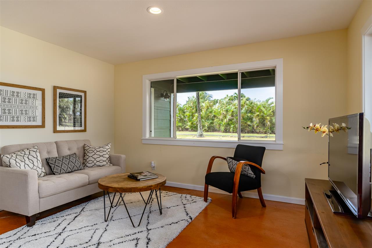 3175 Ua Noe Place, Unit A Haiku, HI 96708 - Photo 24 of 29 a living room with furniture and a window