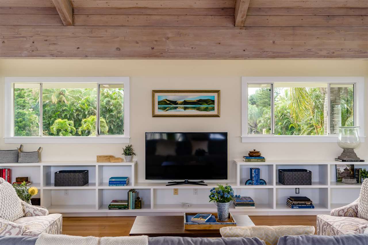 3175 Ua Noe Place, Unit A Haiku, HI 96708 - Photo 4 of 29 a living room with fireplace furniture and a flat screen tv