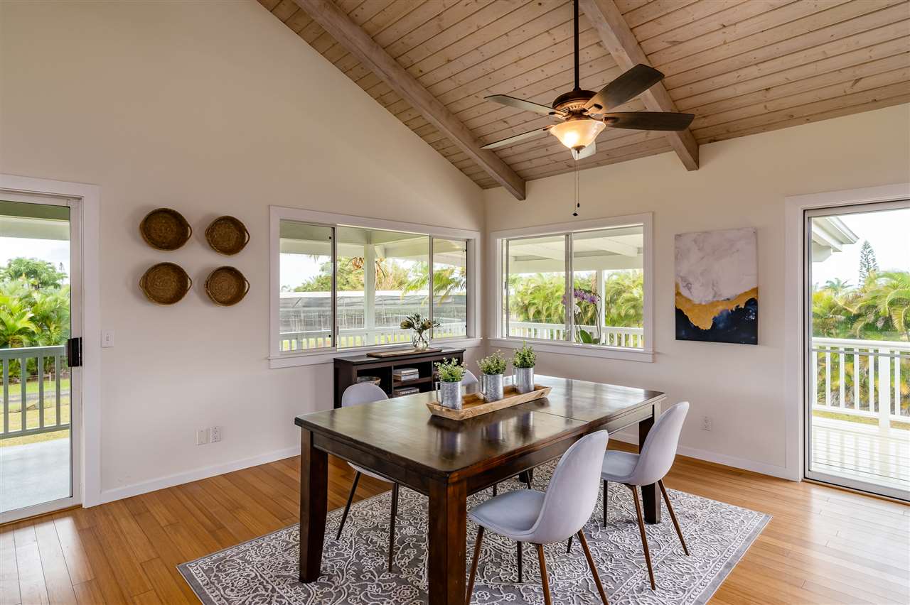3175 Ua Noe Place, Unit A Haiku, HI 96708 - Photo 7 of 29 a view of a dining room with furniture window and wooden floor