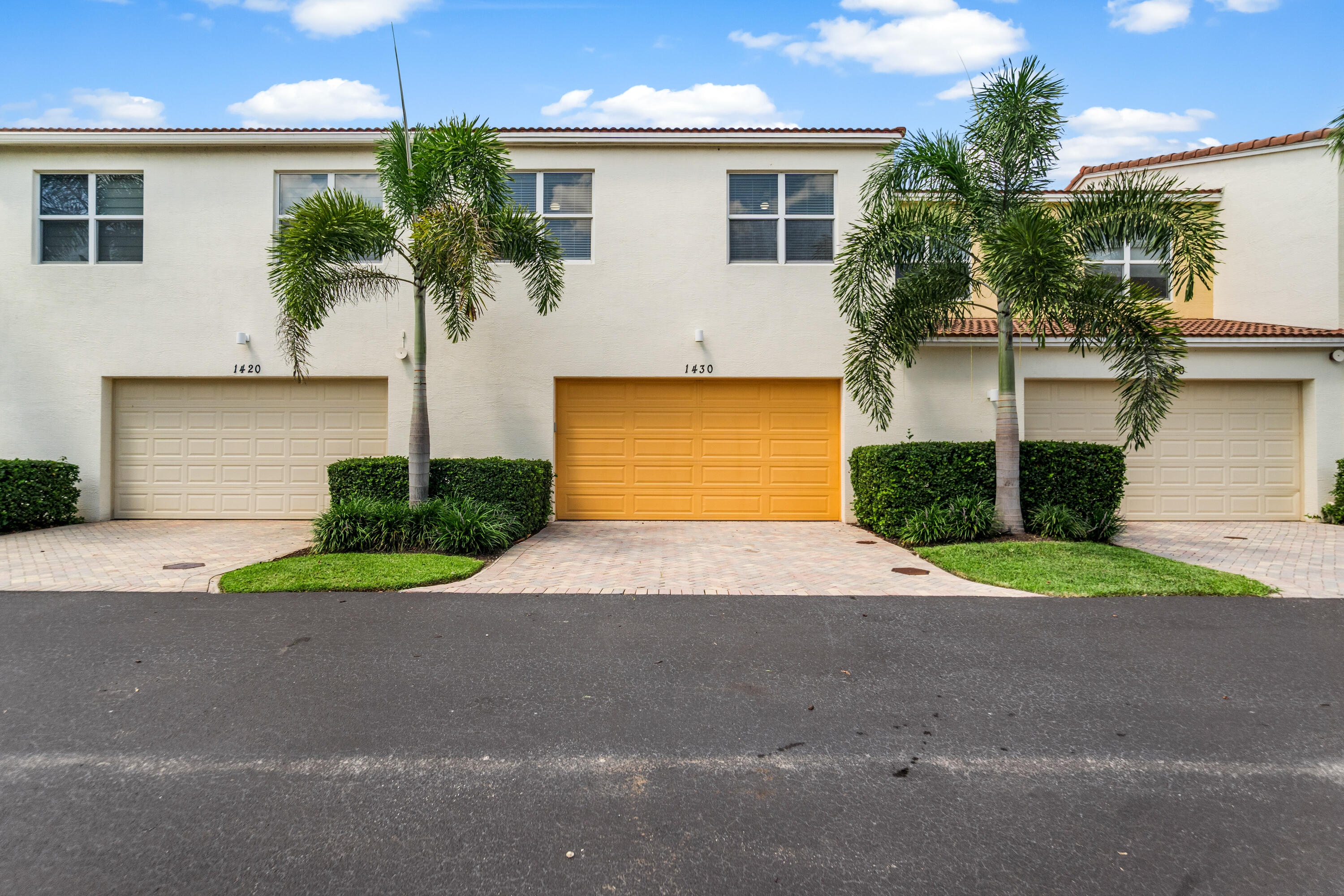 1430 Northwest 48th Lane Boca Raton, FL 33431 - Photo 30 of 54 a front view of a house with a yard and a garage